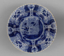 Anonymous, Plate Decorated with a Bird, Flowers and Leaves, Delft, 18th century, Earthenware, diameter 23 cm, The Mesdag Collection, The Hague 